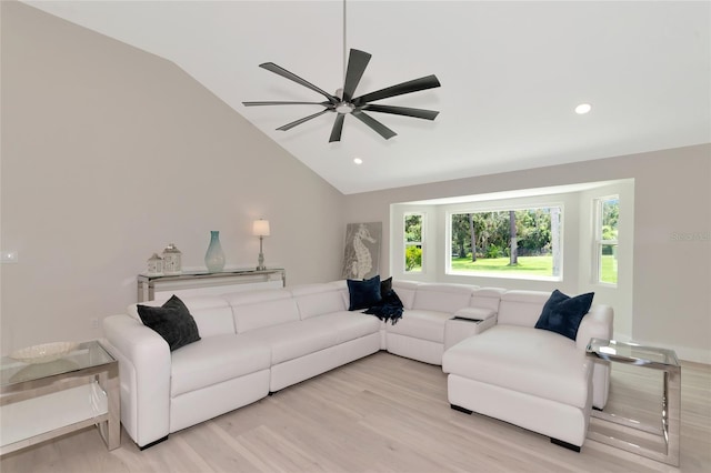 living area featuring recessed lighting, lofted ceiling, and wood finished floors