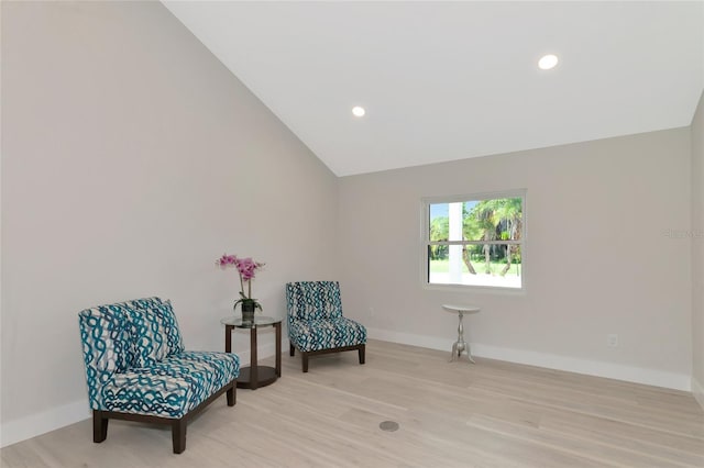 sitting room featuring recessed lighting, light wood-type flooring, baseboards, and vaulted ceiling