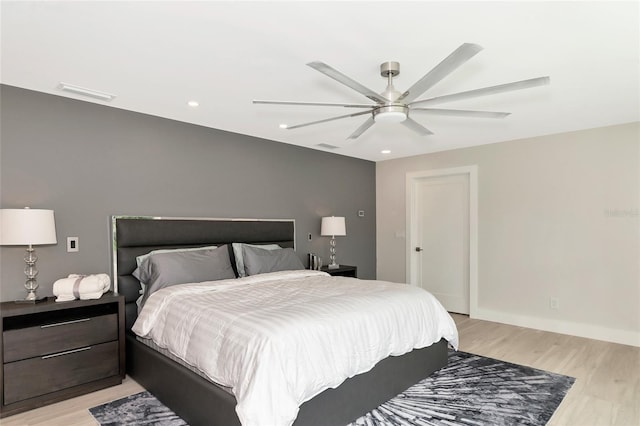 bedroom with recessed lighting, a ceiling fan, visible vents, and light wood finished floors