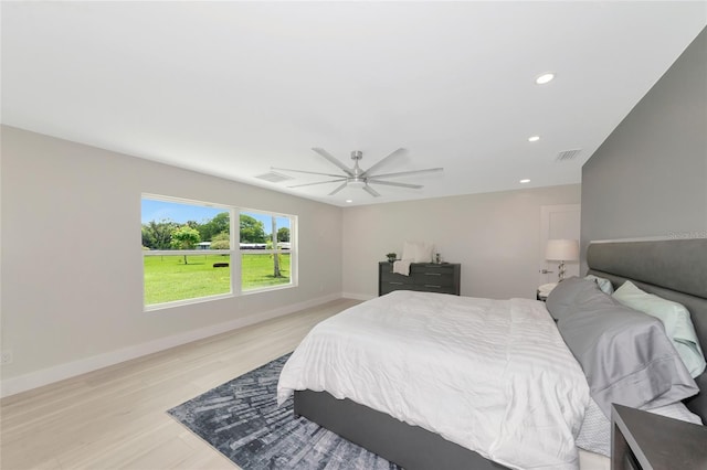 bedroom with baseboards, visible vents, light wood finished floors, recessed lighting, and ceiling fan