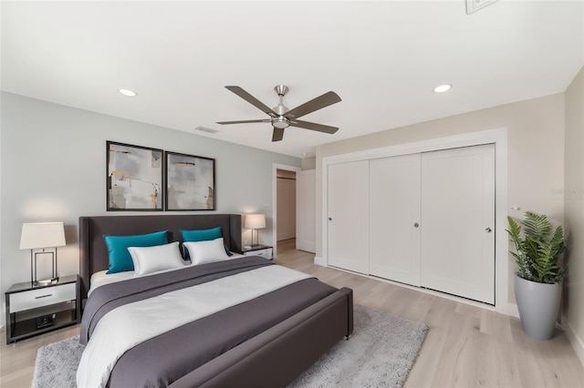 bedroom featuring visible vents, a ceiling fan, recessed lighting, a closet, and light wood finished floors