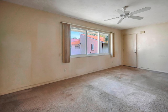 carpeted empty room with ceiling fan