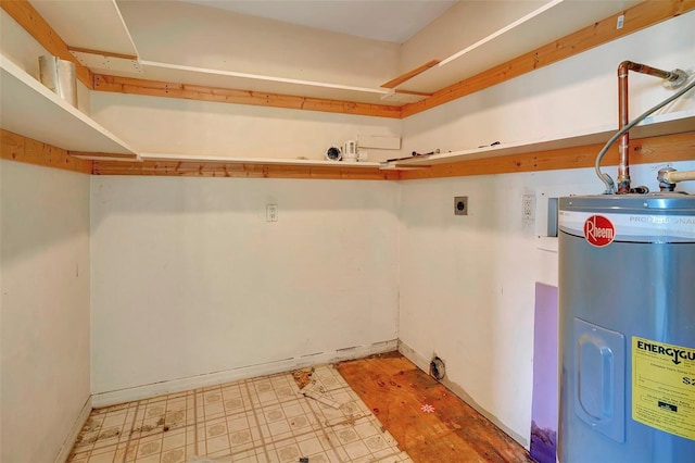 interior space featuring water heater and hookup for an electric dryer