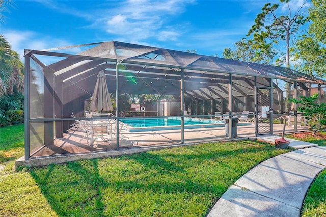 view of pool featuring a lanai, a yard, and a patio