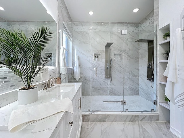 full bathroom with a shower stall, vanity, and recessed lighting