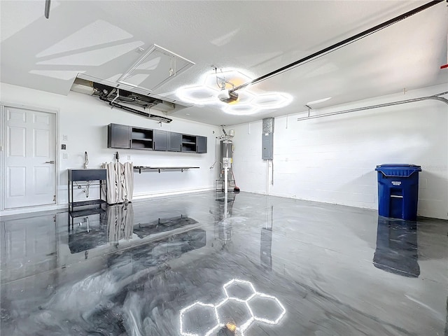 garage featuring gas water heater, electric panel, concrete block wall, and a garage door opener