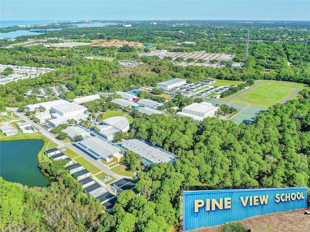 bird's eye view featuring a water view and a wooded view