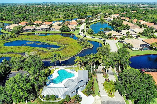 bird's eye view with a residential view and a water view