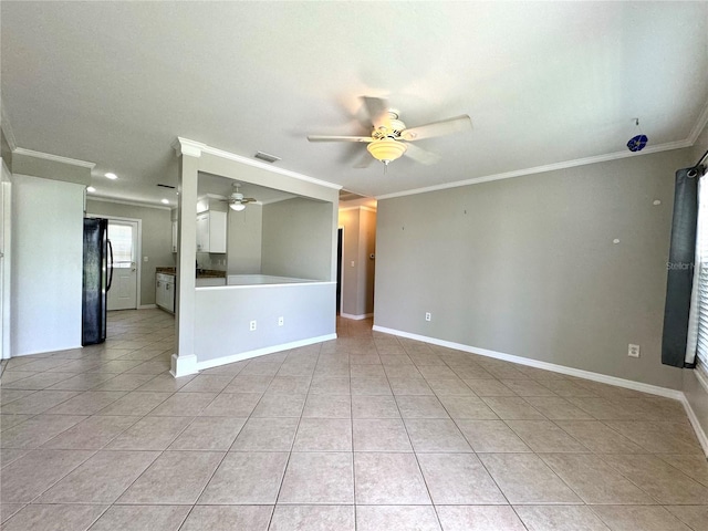 tiled empty room with ceiling fan and crown molding