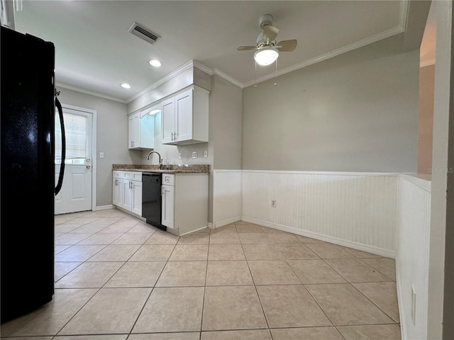 kitchen featuring light tile patterned flooring, crown molding, white cabinetry, and black appliances