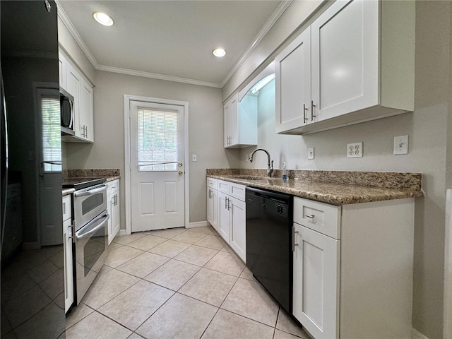 kitchen with white cabinets, light tile patterned floors, sink, crown molding, and stainless steel appliances