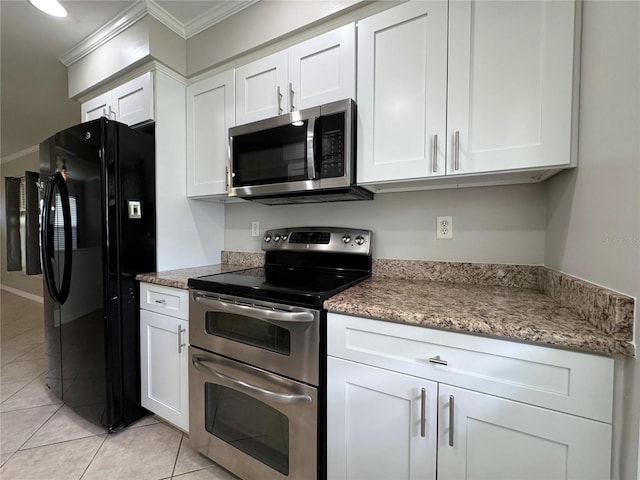 kitchen featuring stainless steel appliances, white cabinetry, ornamental molding, and light tile patterned floors