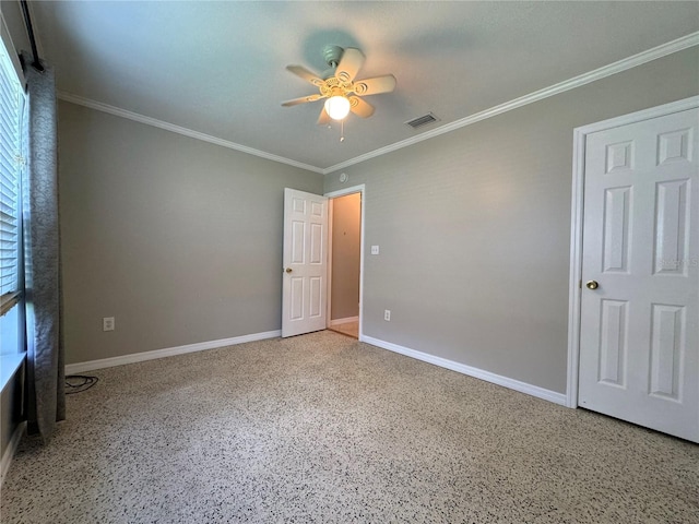 unfurnished bedroom featuring ceiling fan and ornamental molding