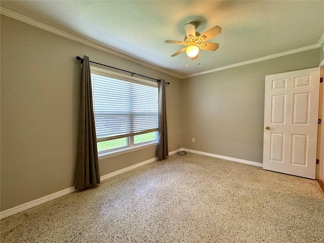 spare room featuring ceiling fan and ornamental molding