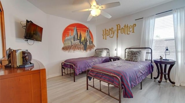 bedroom featuring ceiling fan and light hardwood / wood-style floors