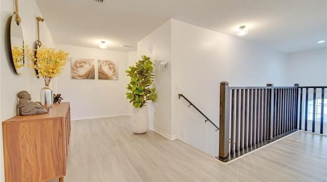 hallway featuring wood-type flooring