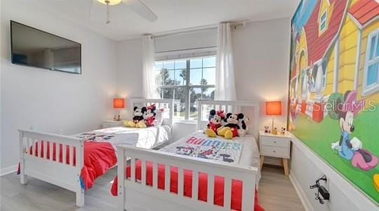 bedroom with ceiling fan and light hardwood / wood-style flooring