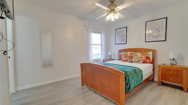 bedroom with ceiling fan and light wood-type flooring