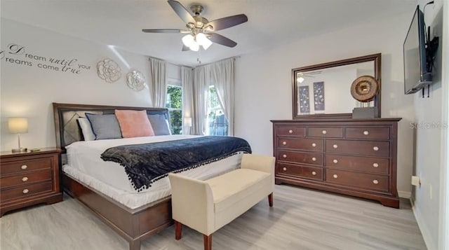 bedroom with light hardwood / wood-style flooring and ceiling fan