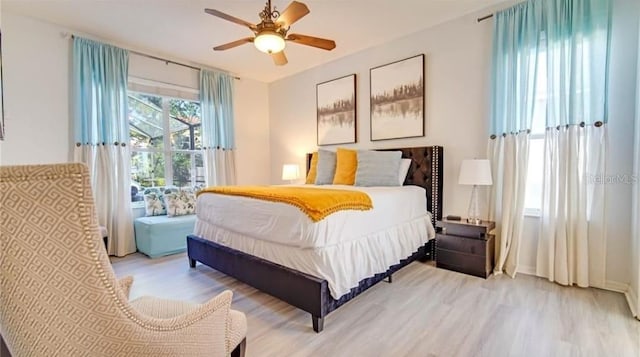 bedroom featuring light wood-type flooring and ceiling fan