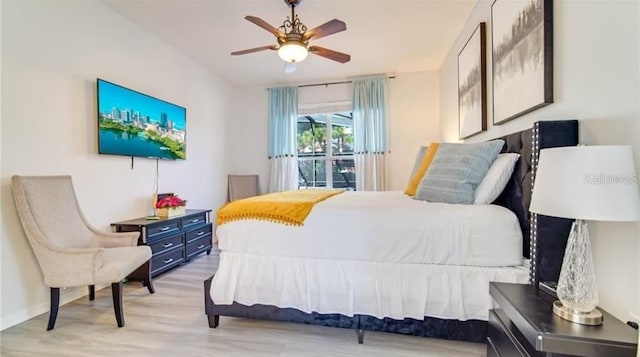 bedroom with ceiling fan and light hardwood / wood-style floors