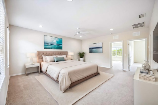 bedroom featuring light carpet and ceiling fan