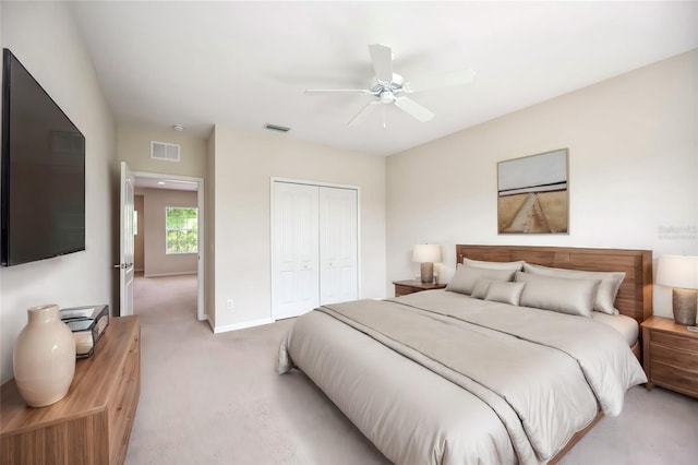 bedroom featuring carpet flooring, ceiling fan, and a closet