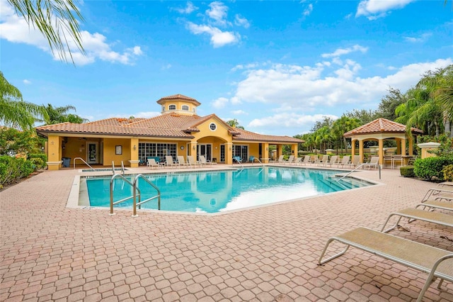 view of swimming pool featuring a gazebo and a patio