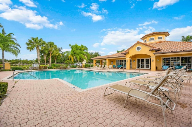 view of swimming pool with a patio