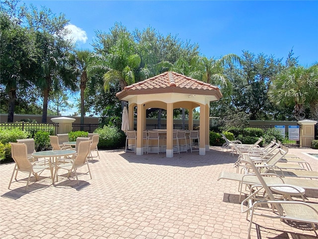 view of patio featuring a gazebo and an outdoor bar