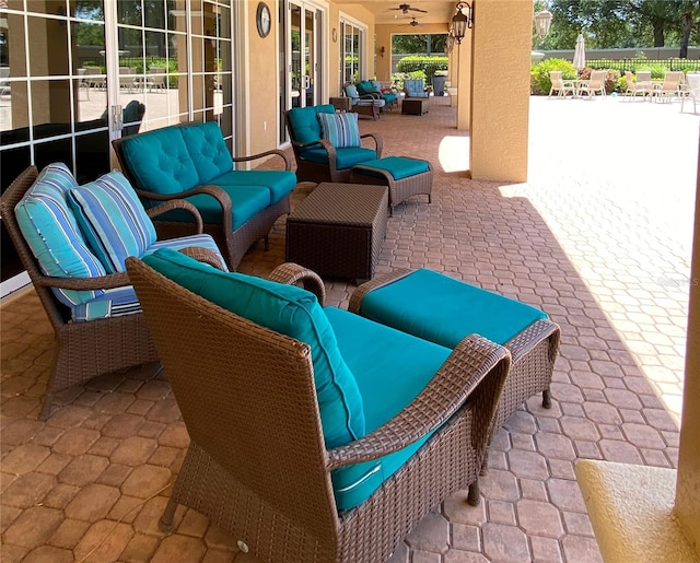 view of patio with french doors, an outdoor hangout area, and ceiling fan