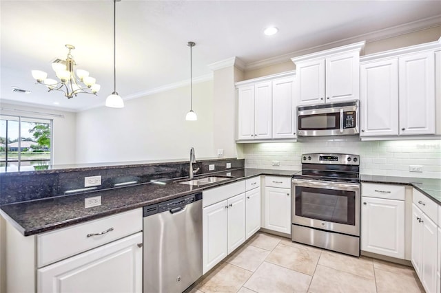 kitchen with stainless steel appliances, sink, an inviting chandelier, white cabinetry, and hanging light fixtures