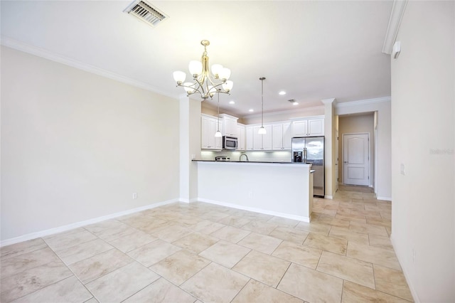 kitchen featuring kitchen peninsula, ornamental molding, stainless steel appliances, white cabinets, and hanging light fixtures