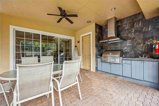 view of patio / terrace with area for grilling, a ceiling fan, outdoor dining space, a sink, and a grill