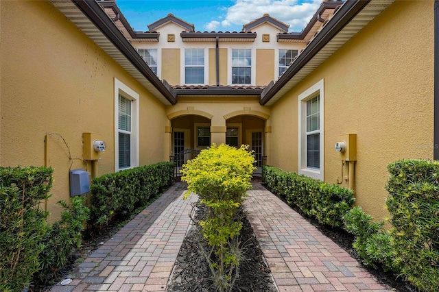 doorway to property with stucco siding