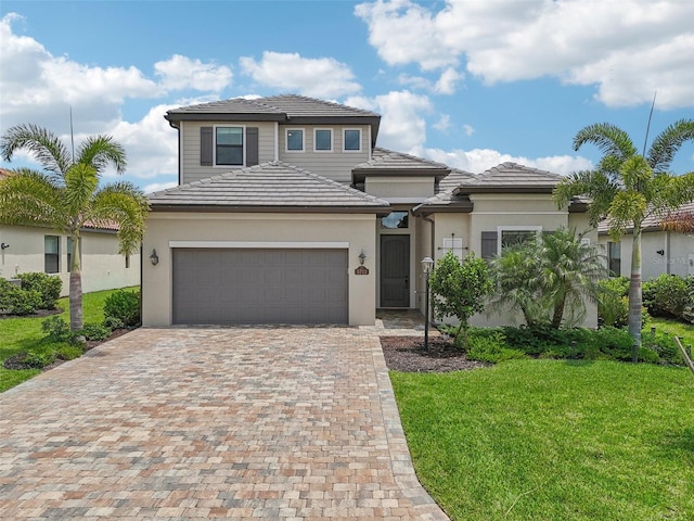 view of front of house featuring a front yard and a garage