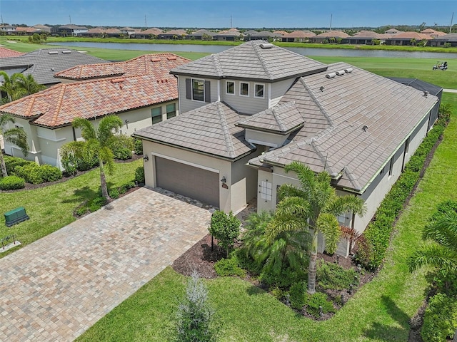 birds eye view of property with a water view