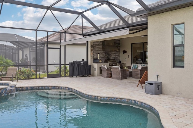 view of pool with area for grilling, an outdoor hangout area, a patio, and exterior kitchen