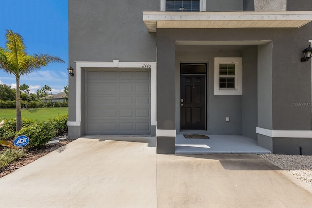 view of exterior entry featuring a garage