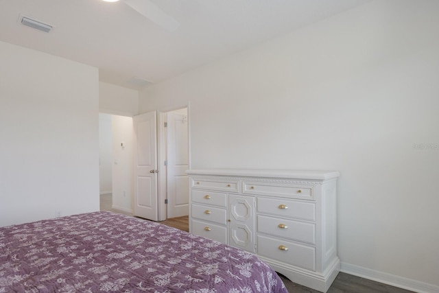 unfurnished bedroom featuring hardwood / wood-style floors and ceiling fan