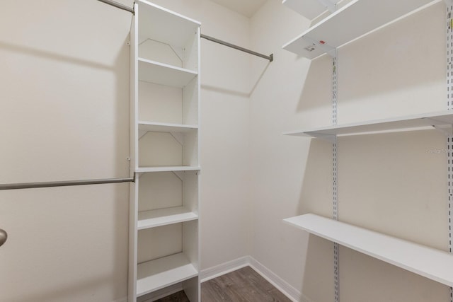 walk in closet featuring hardwood / wood-style flooring