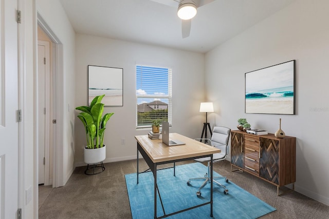 carpeted office space with ceiling fan