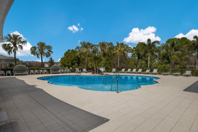 view of swimming pool with a patio