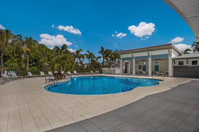 view of pool featuring ceiling fan and a patio area