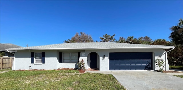 single story home featuring a front yard and a garage