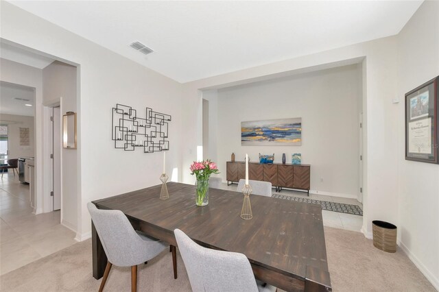 dining area featuring light tile patterned floors