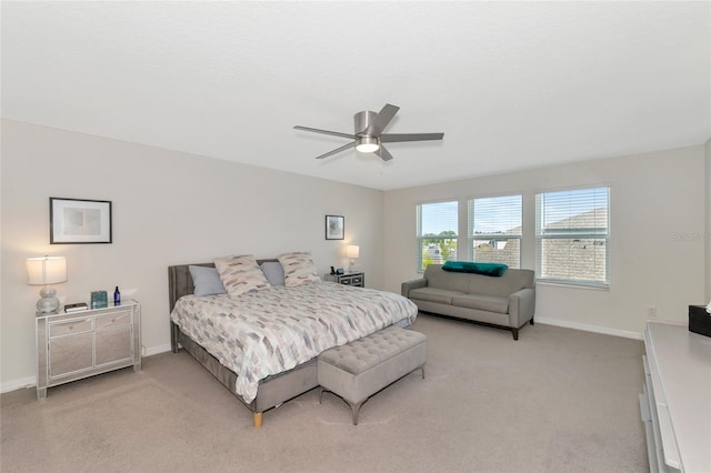 bedroom featuring ceiling fan and light colored carpet