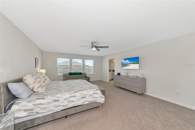 bedroom featuring ceiling fan, baseboards, and light colored carpet