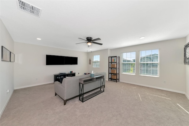 living area featuring baseboards, visible vents, recessed lighting, light colored carpet, and ceiling fan