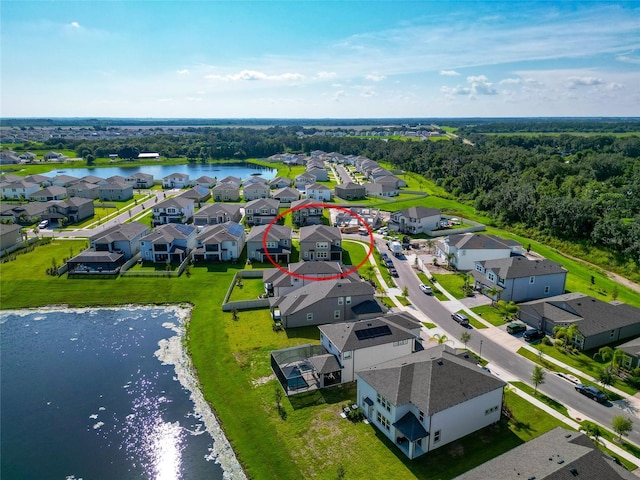 birds eye view of property featuring a residential view and a water view